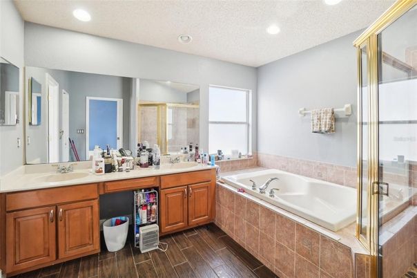Bathroom, Dual Sink Vanities, Glass Shower, Interior, Recessed Lighting, Wood Texture Flooring