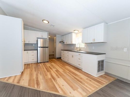 Interior, Kitchen, Recessed Lighting, Stainless Steel Appliances, Wood Texture Flooring