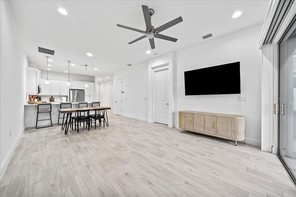 Dining room, Interior, Kitchen, Pendant Lights, Recessed Lighting, Stainless Steel Appliances, Wood Texture Flooring