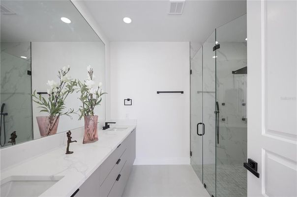 Bathroom, Dual Sink Vanities, Glass Shower, Interior, Marble Walls, Recessed Lighting