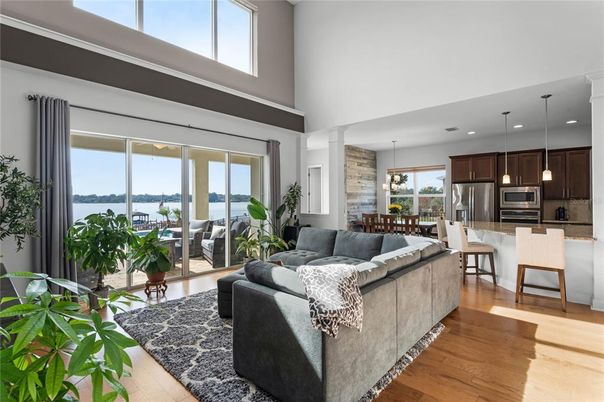 Dining room, Interior, Kitchen, Living room, Pendant Lights, Recessed Lighting, Stainless Steel Appliances, Water, Wood Texture Flooring