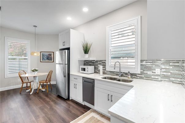 Dining room, Interior, Kitchen, Pendant Lights, Recessed Lighting, Stainless Steel Appliances, Wood Texture Flooring