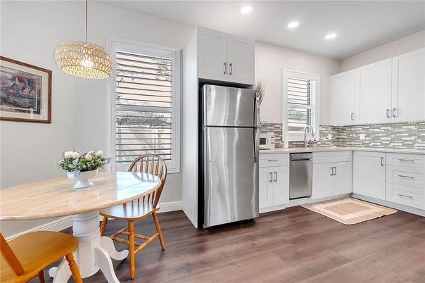 Dining room, Interior, Kitchen, Pendant Lights, Recessed Lighting, Stainless Steel Appliances, Wood Texture Flooring