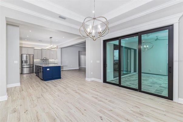 Chandelier, Interior, Kitchen, Pendant Lights, Recessed Lighting, Stainless Steel Appliances, Wood Texture Flooring