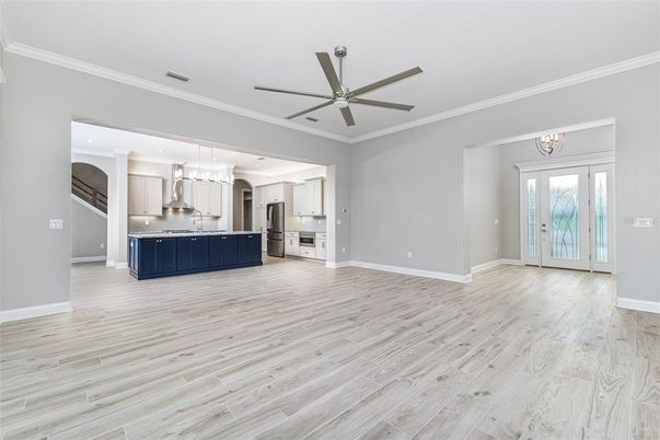 Empty room, Interior, Kitchen, Pendant Lights, Recessed Lighting, Stainless Steel Appliances, Wood Texture Flooring