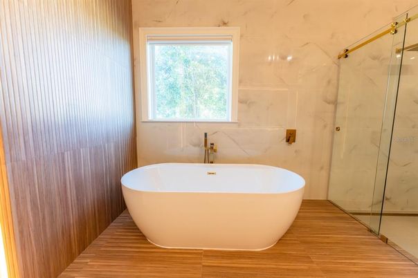 Bathroom, Free Standing Baths, Glass Shower, Interior, Marble Walls, Wood Texture Flooring