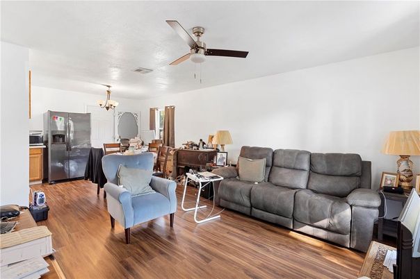 Chandelier, Dining room, Interior, Kitchen, Living room, Stainless Steel Appliances, Wood Texture Flooring