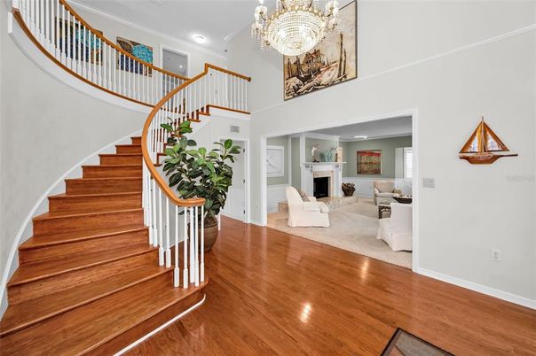 Chandelier, Fireplace, Interior, Living room, Recessed Lighting, Wood Texture Flooring