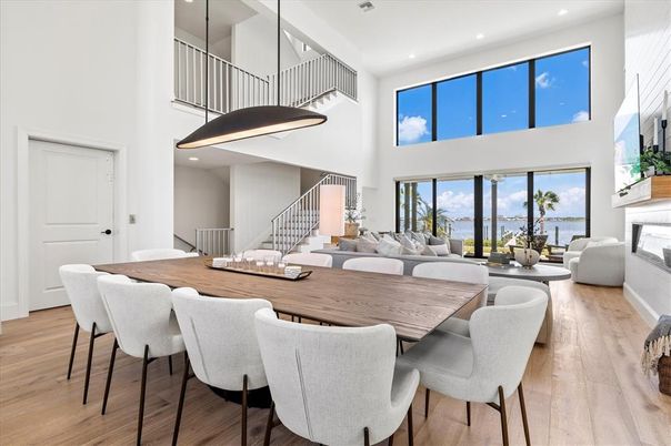 Dining room, Fireplace, Interior, Living room, Recessed Lighting, Water, Wood Texture Flooring