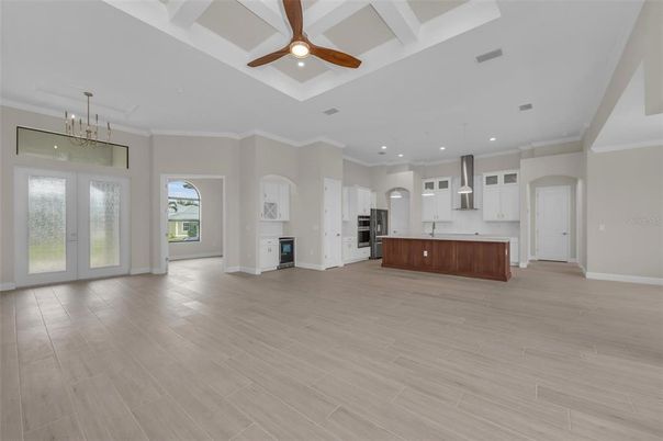 Empty room, Interior, Kitchen, Pendant Lights, Recessed Lighting, Stainless Steel Appliances, Wood Texture Flooring