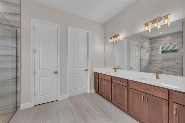 Bathroom, Dual Sink Vanities, Glass Shower, Interior, Wood Texture Flooring