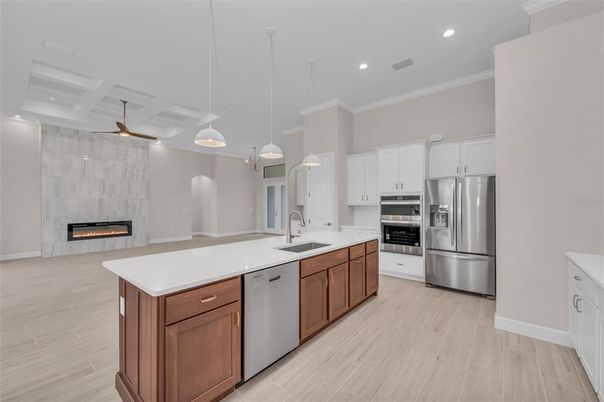 Fireplace, Interior, Kitchen, Pendant Lights, Recessed Lighting, Stainless Steel Appliances, Wood Texture Flooring