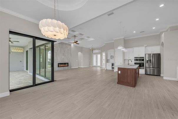 Fireplace, Interior, Kitchen, Pendant Lights, Recessed Lighting, Stainless Steel Appliances, Wood Texture Flooring