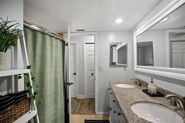 Bathroom, Dual Sink Vanities, Interior, Recessed Lighting, Wood Texture Flooring