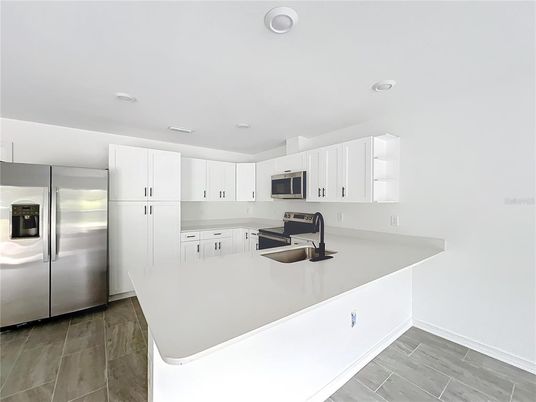 Interior, Kitchen, Recessed Lighting, Stainless Steel Appliances, Wood Texture Flooring