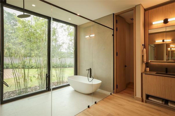 Bathroom, Free Standing Baths, Glass Shower, Interior, Recessed Lighting, Wood Texture Flooring