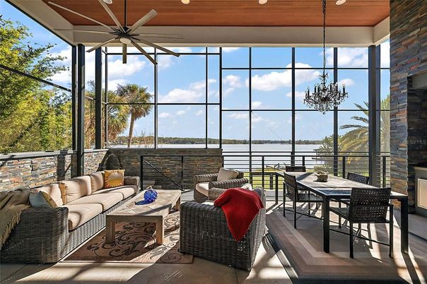 Chandelier, Fireplace, Interior, Living room, Sun Room, Water, Wooden Ceilings