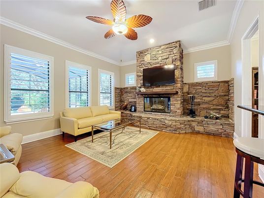 Fireplace, Interior, Living room, Recessed Lighting, Stone Walls, Wood Texture Flooring