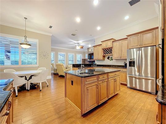 Dining room, Interior, Kitchen, Pendant Lights, Recessed Lighting, Stainless Steel Appliances, Wood Texture Flooring