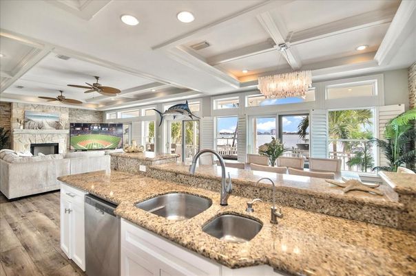 Chandelier, Fireplace, Interior, Kitchen, Living room, Recessed Lighting, Wood Texture Flooring