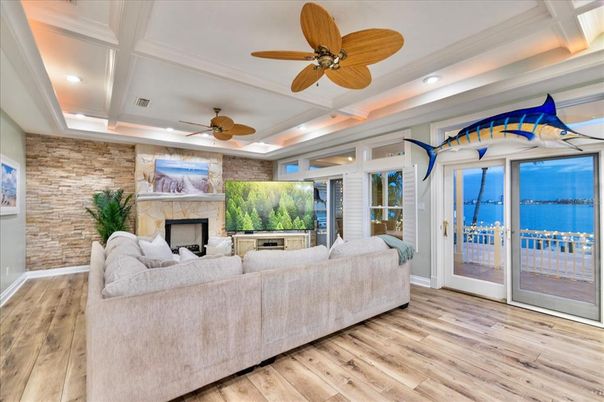 Fireplace, Interior, Living room, Recessed Lighting, Stone Walls, Wood Texture Flooring