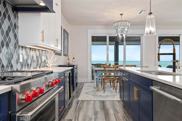 Chandelier, Dining room, Interior, Kitchen, Pendant Lights, Recessed Lighting, Stainless Steel Appliances, Water, Wood Texture Flooring
