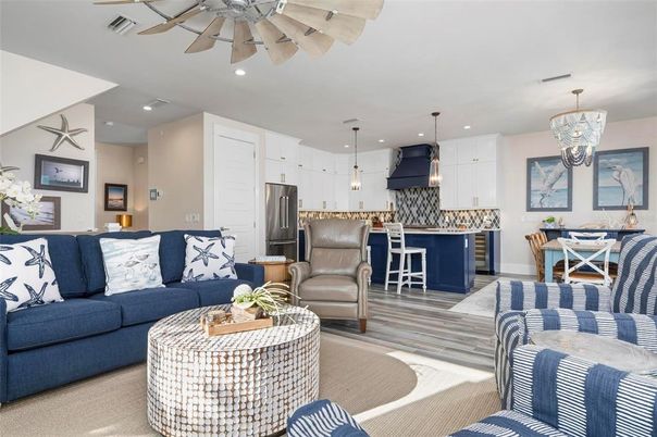 Chandelier, Dining room, Interior, Kitchen, Living room, Pendant Lights, Recessed Lighting, Stainless Steel Appliances, Wood Texture Flooring