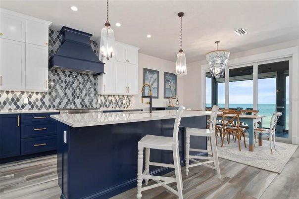 Chandelier, Dining room, Interior, Kitchen, Pendant Lights, Recessed Lighting, Water, Wood Texture Flooring