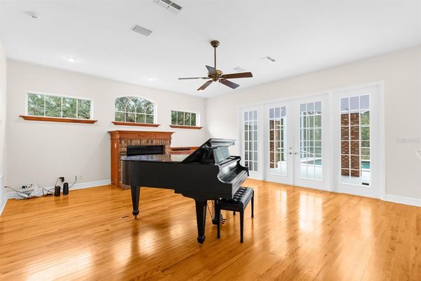 Fireplace, Interior, Piano, Recessed Lighting, Wood Texture Flooring