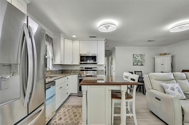 Dining room, Interior, Kitchen, Recessed Lighting, Stainless Steel Appliances, Wood Texture Flooring