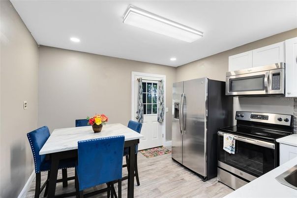 Dining room, Interior, Kitchen, Recessed Lighting, Stainless Steel Appliances, Wood Texture Flooring