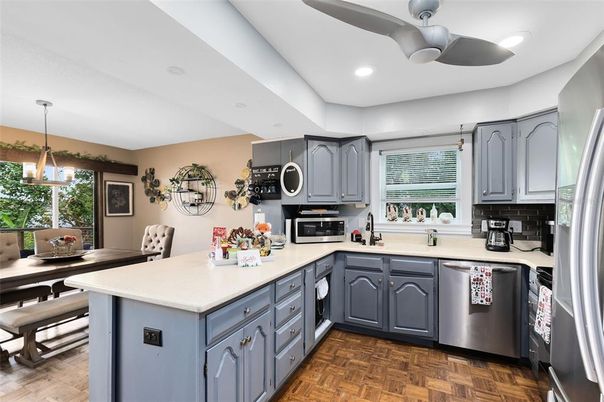Dining room, Interior, Kitchen, Pendant Lights, Recessed Lighting, Stainless Steel Appliances, Wood Texture Flooring