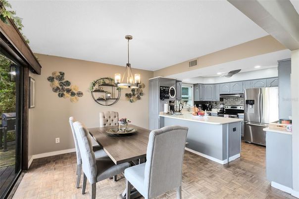 Dining room, Interior, Kitchen, Pendant Lights, Recessed Lighting, Stainless Steel Appliances, Wood Texture Flooring