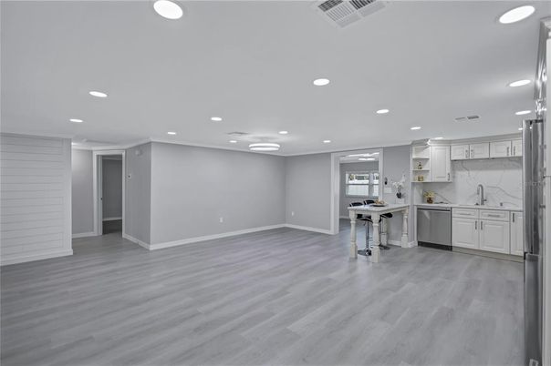 Interior, Kitchen, Marble Walls, Recessed Lighting, Stainless Steel Appliances, Wood Texture Flooring
