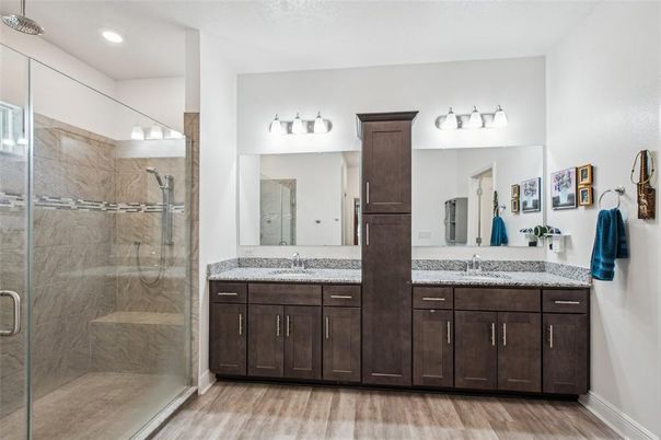 Bathroom, Dual Sink Vanities, Glass Shower, Interior, Recessed Lighting, Wood Texture Flooring