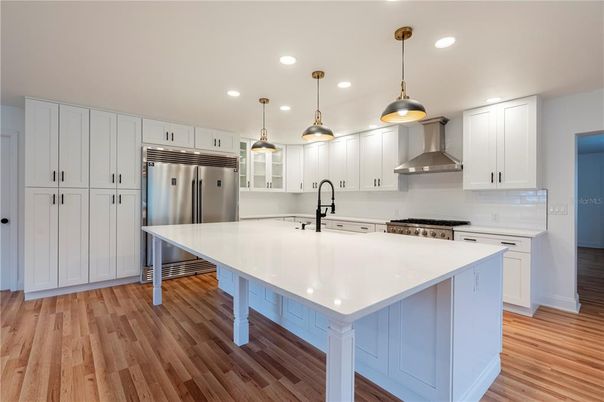 Interior, Kitchen, Pendant Lights, Recessed Lighting, Stainless Steel Appliances, Wood Texture Flooring