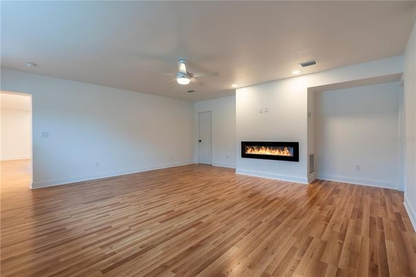 Empty room, Fireplace, Interior, Recessed Lighting, Wood Texture Flooring