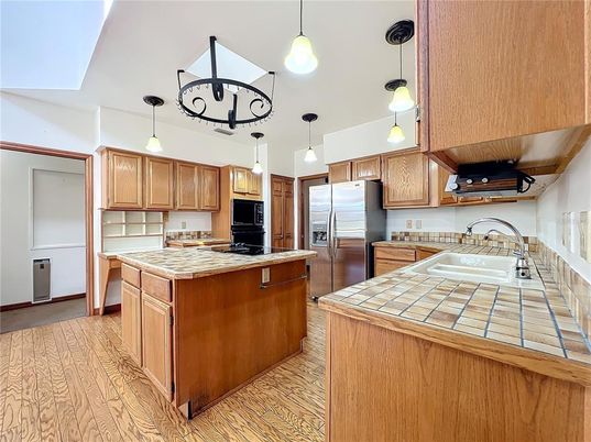 Interior, Kitchen, Pendant Lights, Tile Countertops, Wood Texture Flooring