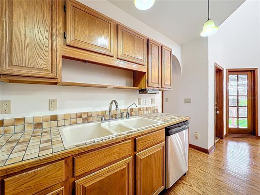 Interior, Kitchen, Pendant Lights, Tile Countertops, Wood Texture Flooring