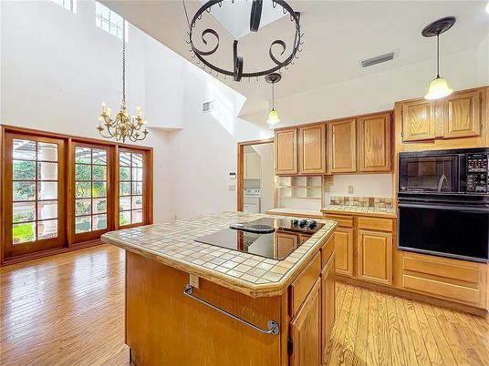 Chandelier, Interior, Kitchen, Pendant Lights, Tile Countertops, Wood Texture Flooring