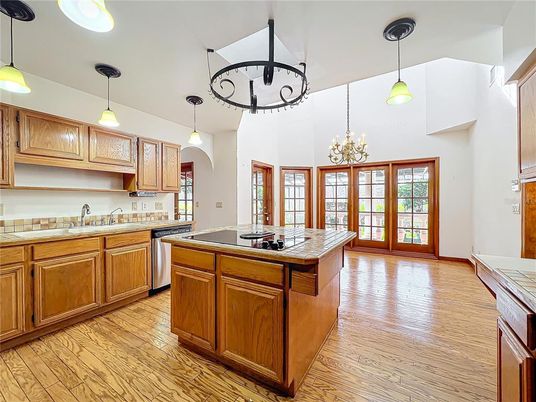 Chandelier, Interior, Kitchen, Pendant Lights, Tile Countertops, Wood Texture Flooring