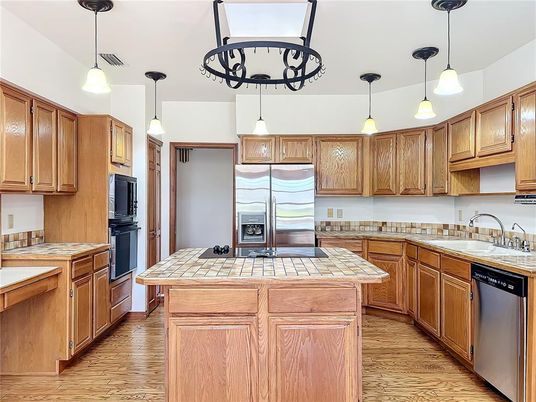 Interior, Kitchen, Pendant Lights, Tile Countertops, Wood Texture Flooring
