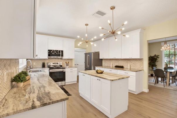 Dining room, Interior, Kitchen, Pendant Lights, Stainless Steel Appliances, Wood Texture Flooring