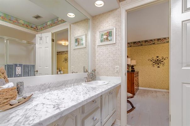 Bathroom, Dual Sink Vanities, Interior, Recessed Lighting, Wood Texture Flooring