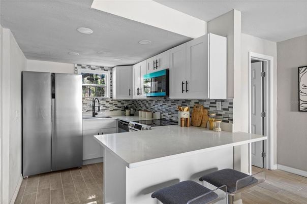 Interior, Kitchen, Recessed Lighting, Stainless Steel Appliances, Wood Texture Flooring