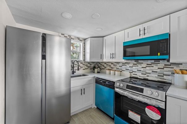 Interior, Kitchen, Recessed Lighting, Stainless Steel Appliances, Wood Texture Flooring