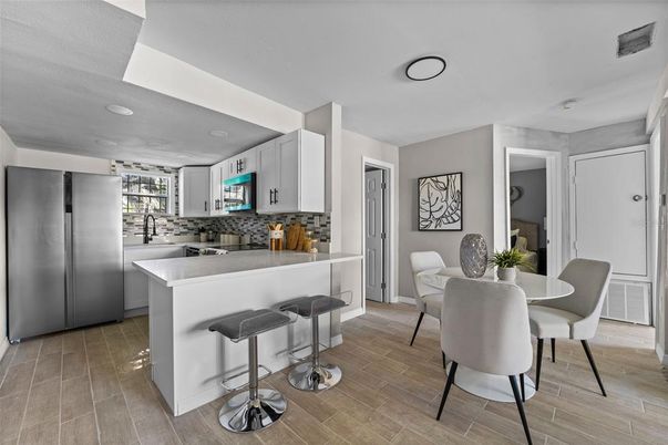 Dining room, Interior, Kitchen, Recessed Lighting, Stainless Steel Appliances, Wood Texture Flooring