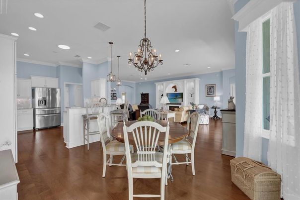 Chandelier, Dining room, Interior, Kitchen, Living room, Pendant Lights, Recessed Lighting, Stainless Steel Appliances, Wood Texture Flooring