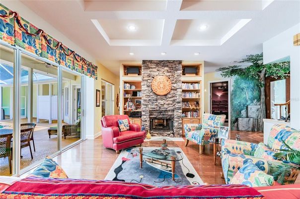 Fireplace, Interior, Living room, Recessed Lighting, Stone Walls, Wood Texture Flooring