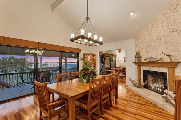 Chandelier, Dining room, Fireplace, Interior, Pendant Lights, Recessed Lighting, Water, Wood Texture Flooring